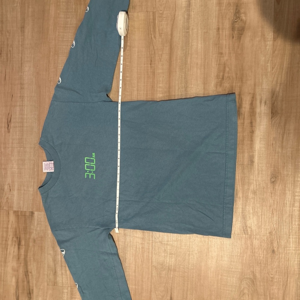 Teal Long Sleeve Shirt with white print that glows in the dark